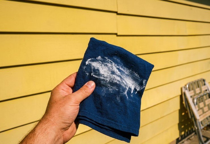 a chalk rub test leaves white residue on a dark cloth