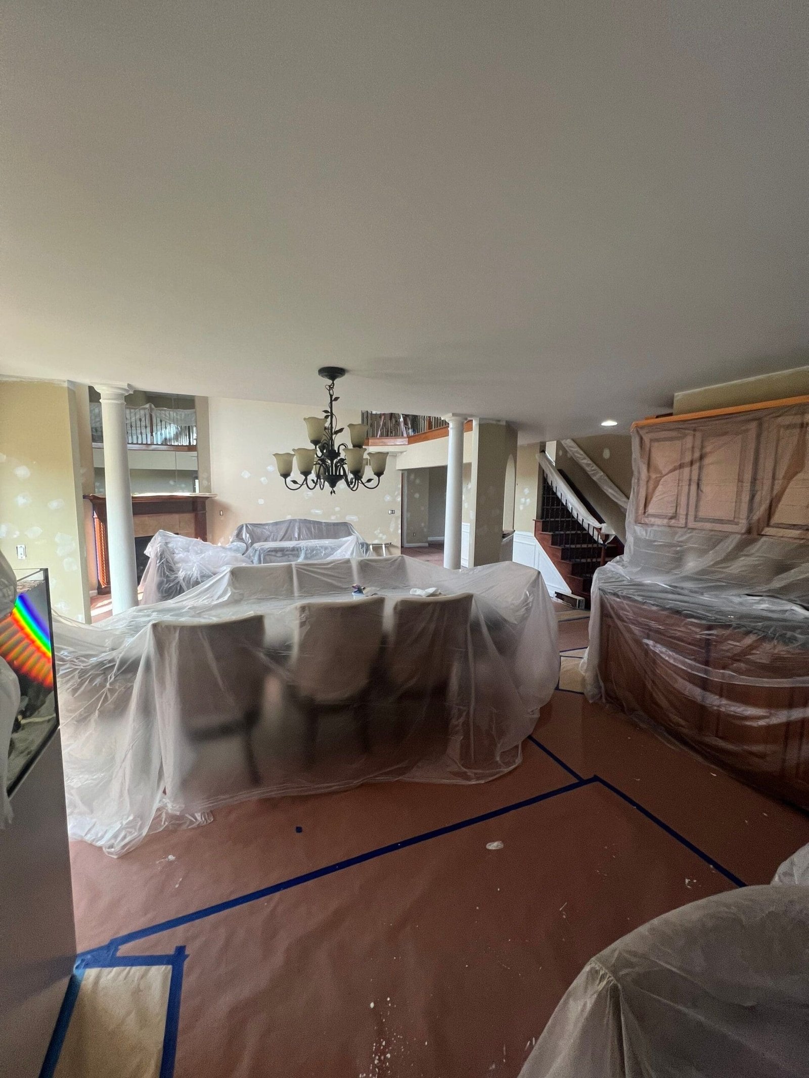 a dining table covered in plastic