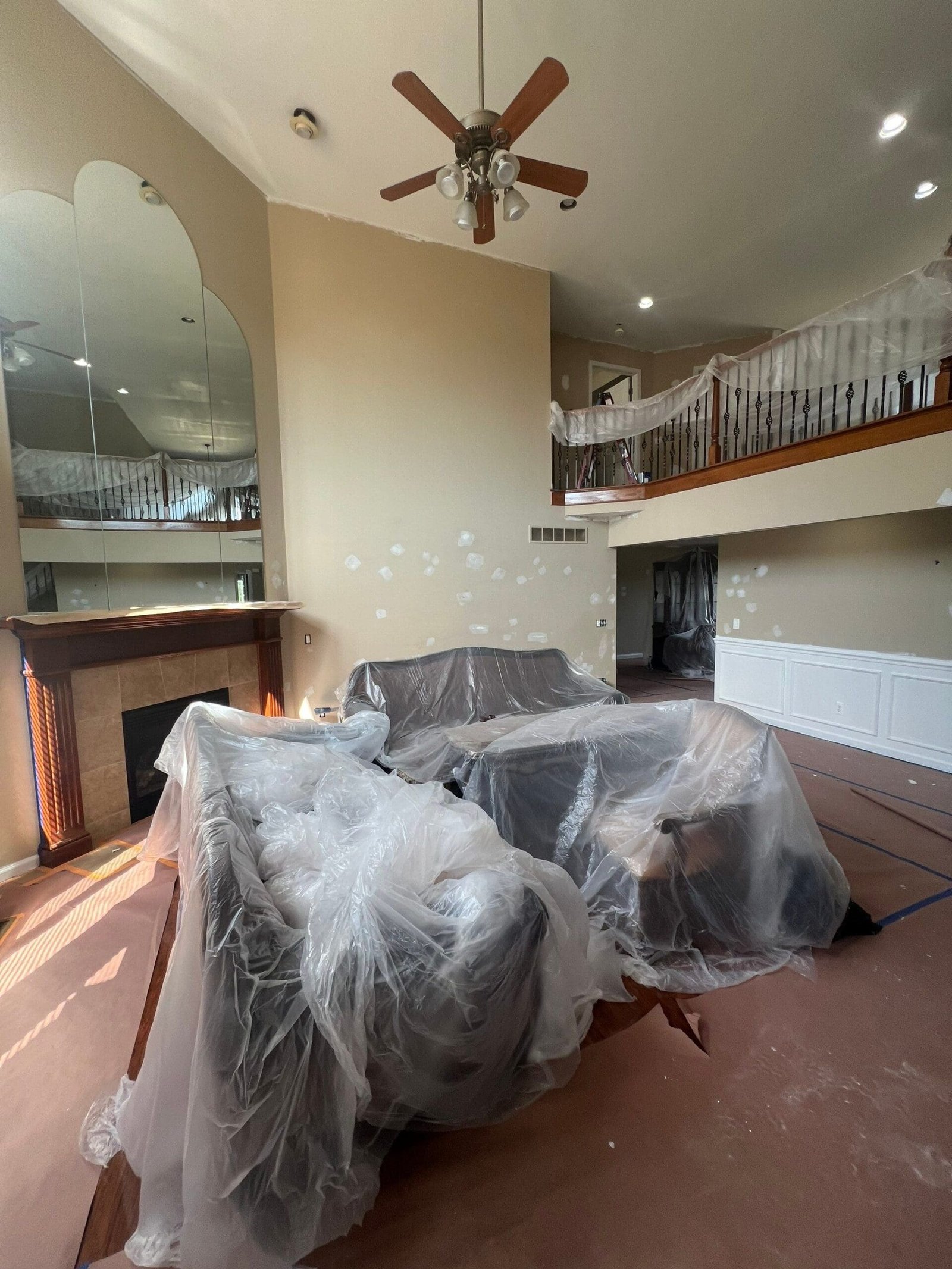 a couch covered in plastic