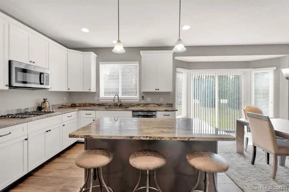 Budget Painting: Maximizing Impact Without Breaking the Bank 3 a kitchen with a large island