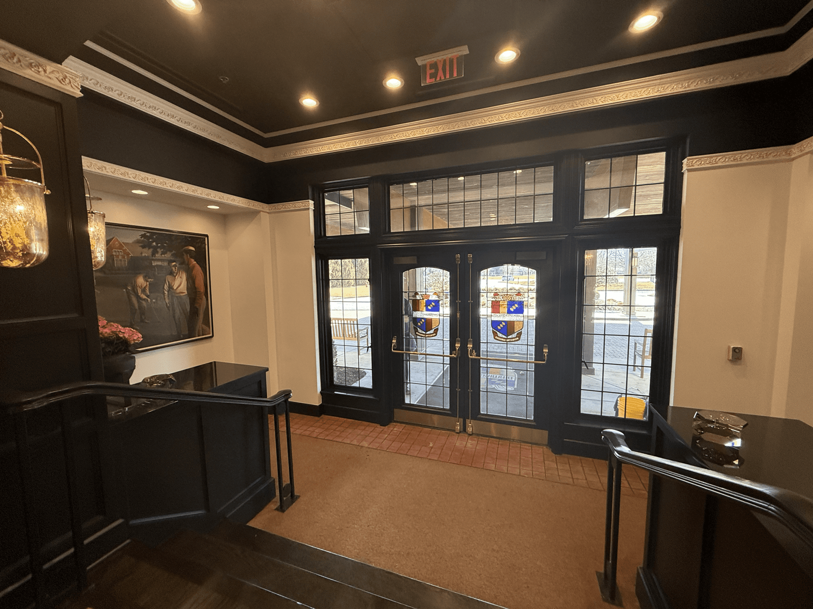 interior hallway with glass door and stairs