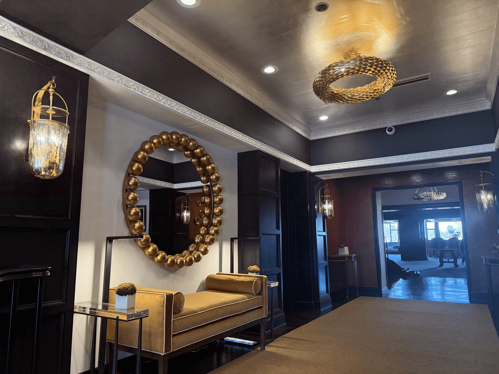 interior room with a mirror and a couch