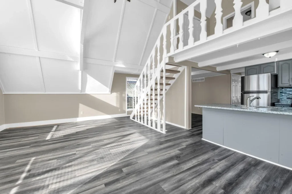 Painting on a Budget: Where to Splurge and Where to Save 1 a room with a staircase and a bar