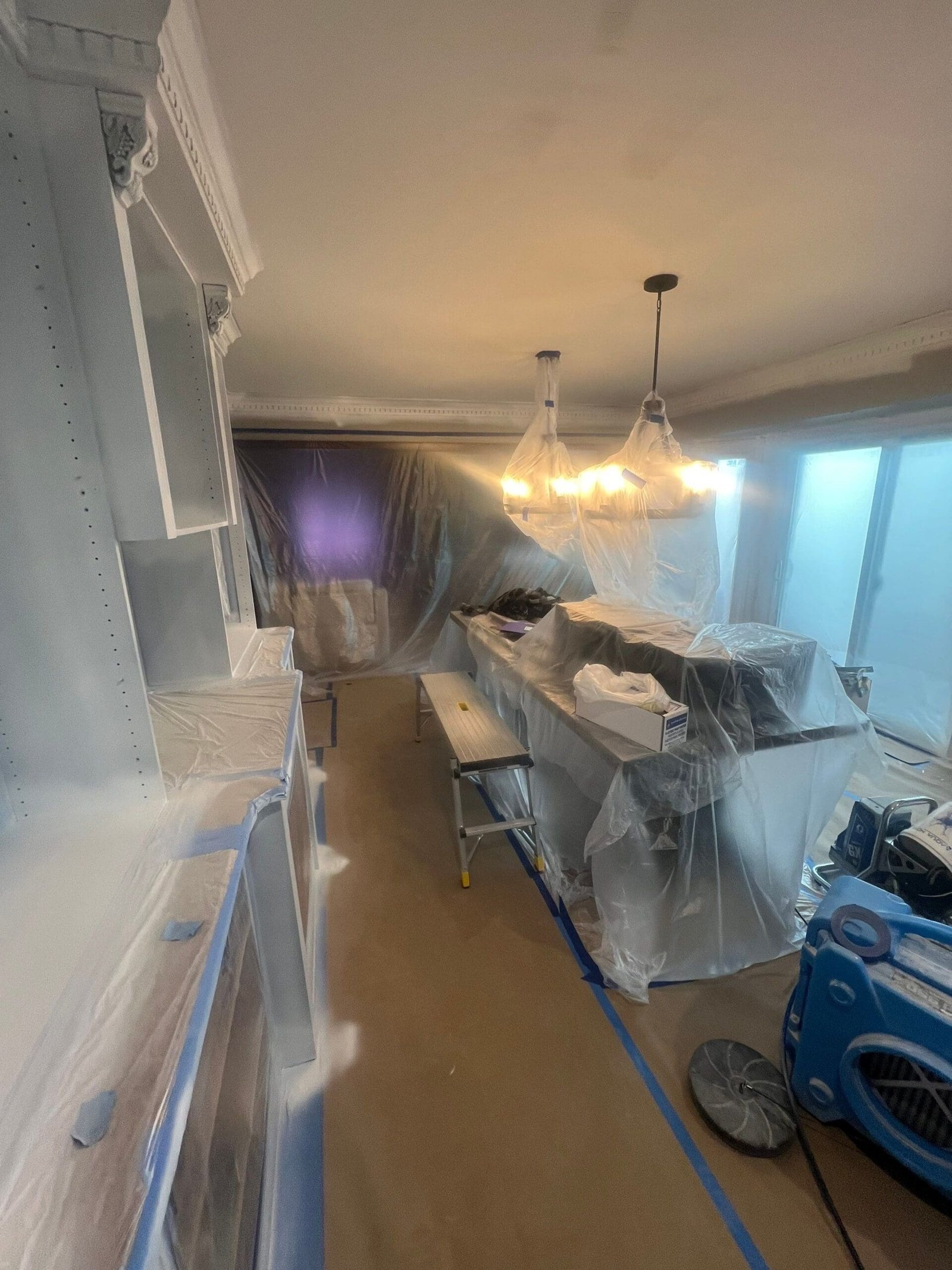 Macomb Kitchen Renovation 8 a kitchen cabinets covered in plastic