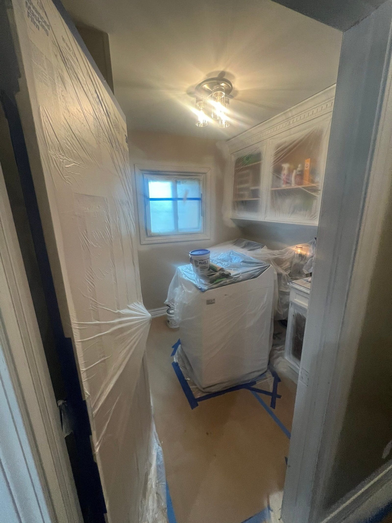 Macomb Kitchen Renovation 7 a door covered in plastic