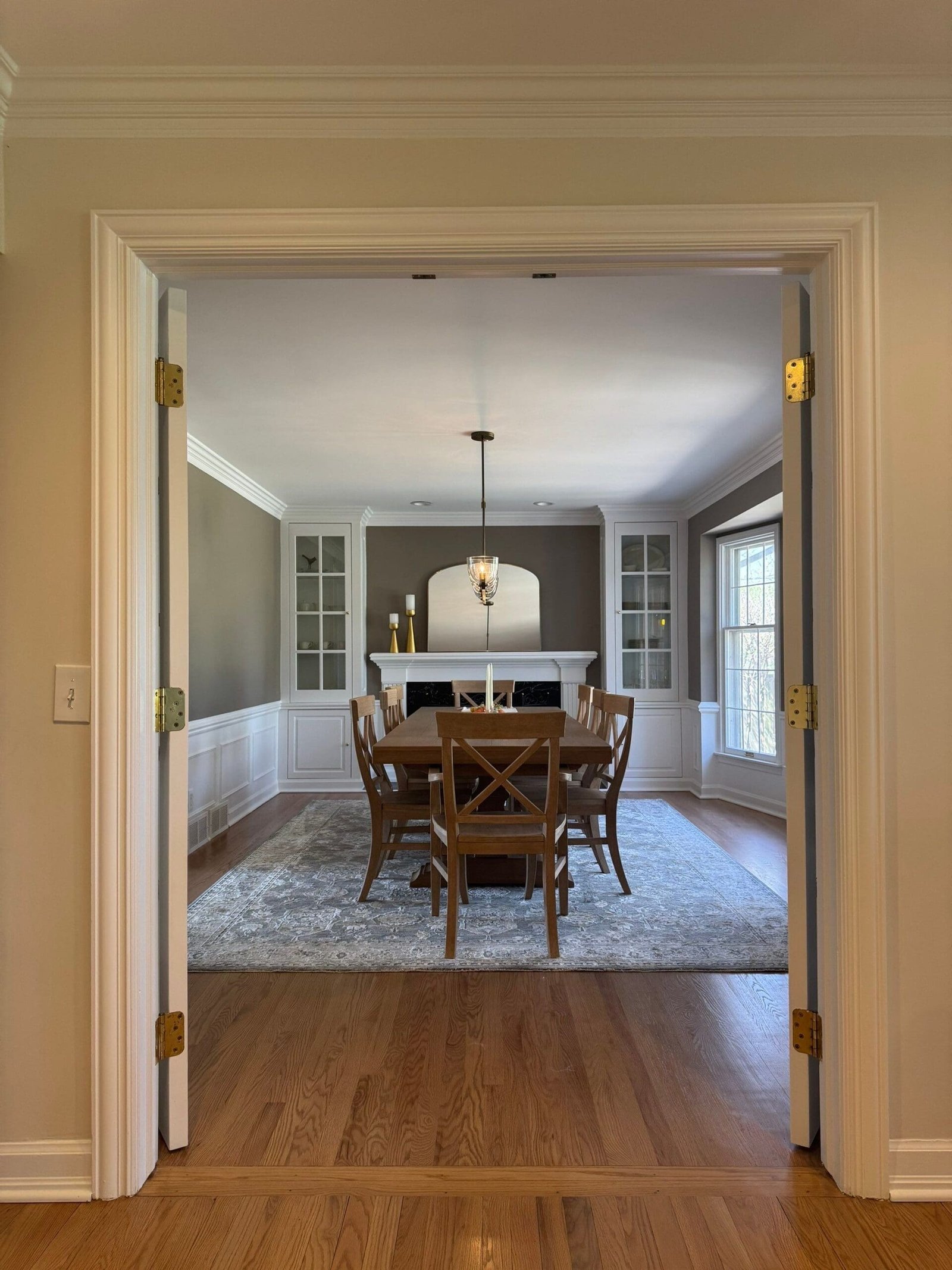 a dining room with a table and chairs