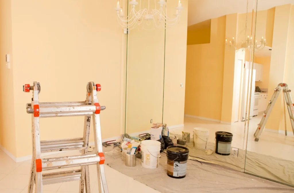 Brighten Your Home with New Paint in Sterling Heights 8 a ladder next a ladder next to paint buckets and bucketto paint