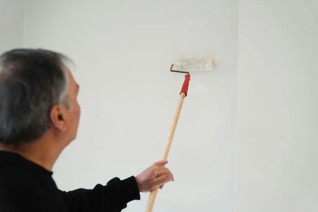 a man painting a wall