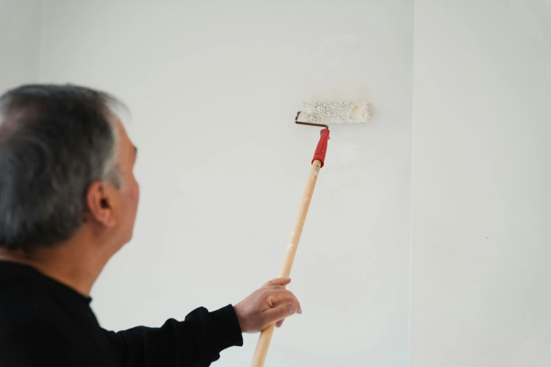 a man painting a wall