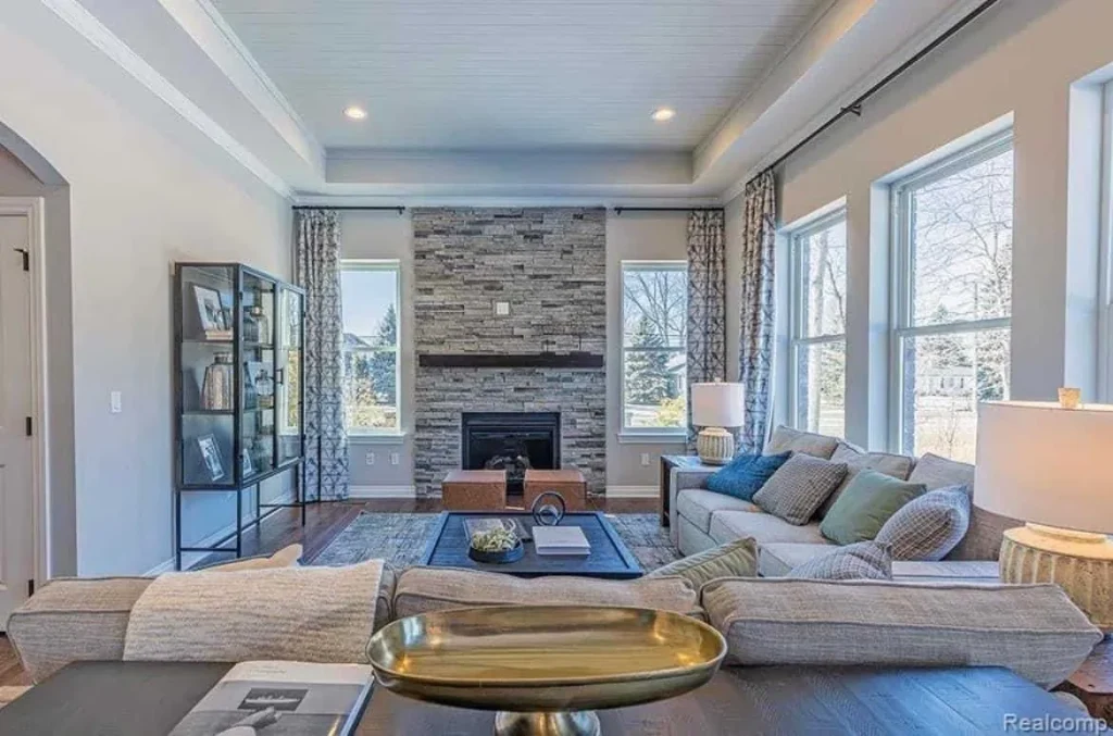 Most Preferred Winter Paint Colors for Living Rooms for 2023 2 a living room with a fireplace and couches